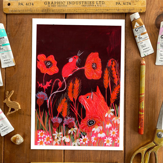 Artistic depiction of foxes among flowers on a wooden surface with art supplies.