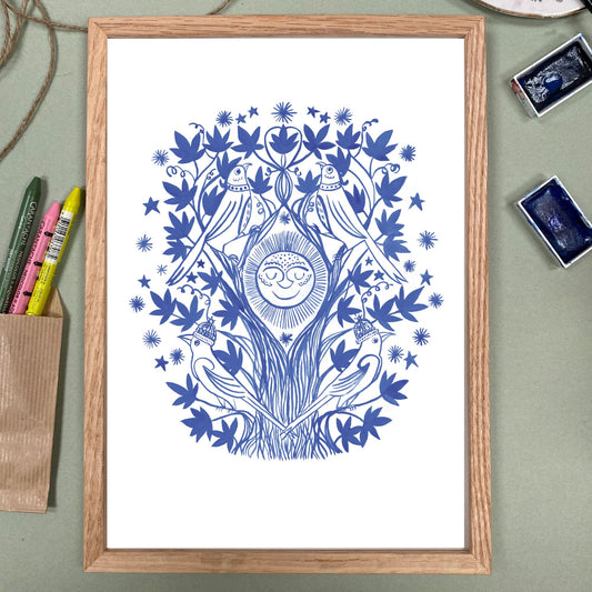Framed artwork with blue abstract design on a white background, placed on a light green surface.