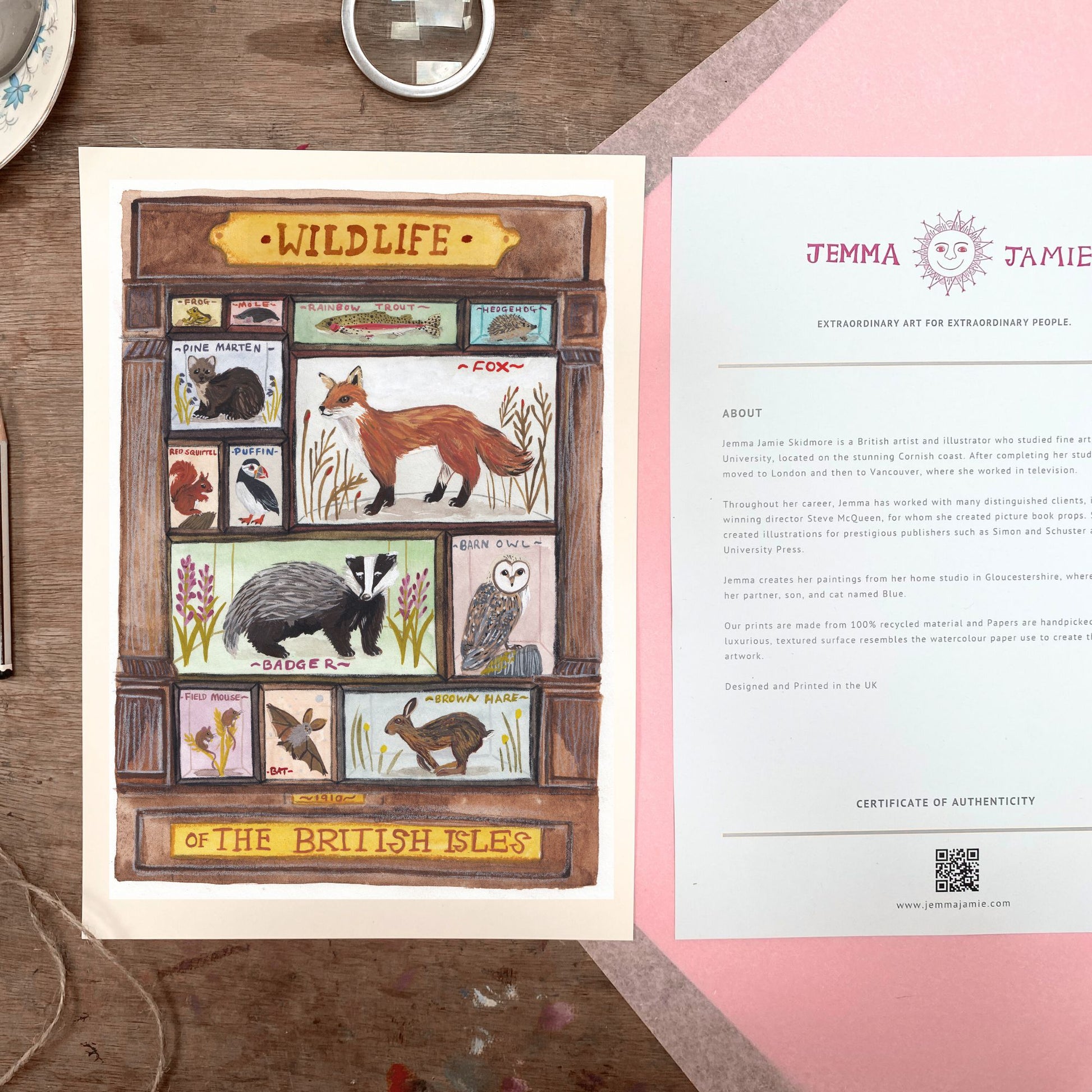 Illustration of wildlife of the British Isles on a wooden surface with a certificate of authenticity.
