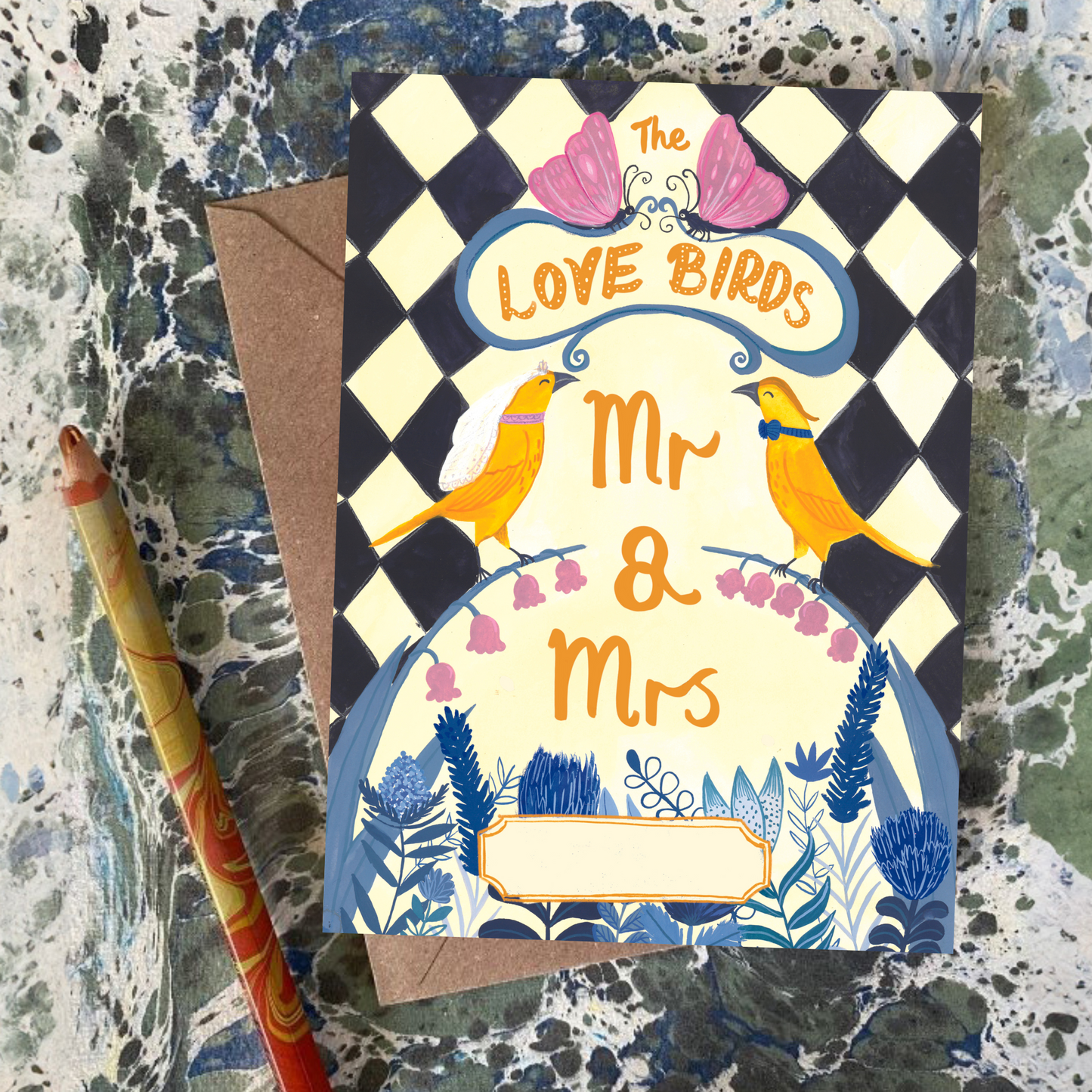 Greeting card with 'Love Birds Mr & Mrs' design on a textured surface